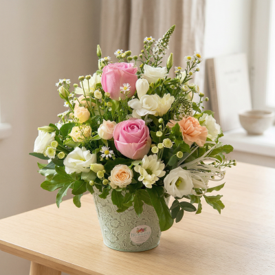 Pot of Happiness - A small but choice selection of flowers arranged in a petite container.